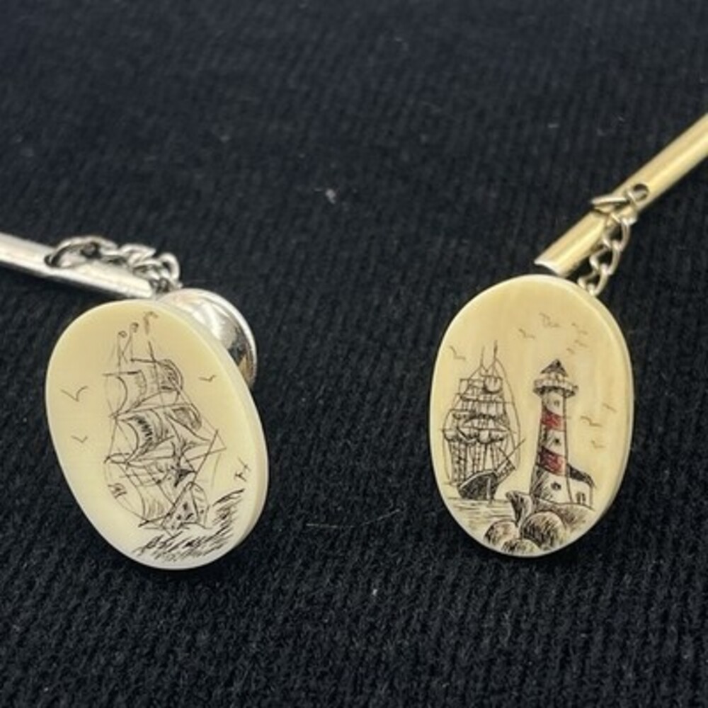 2 VTG scrimshaw tie tacks featuring a detailed nautical Sailboat And Lighthouse